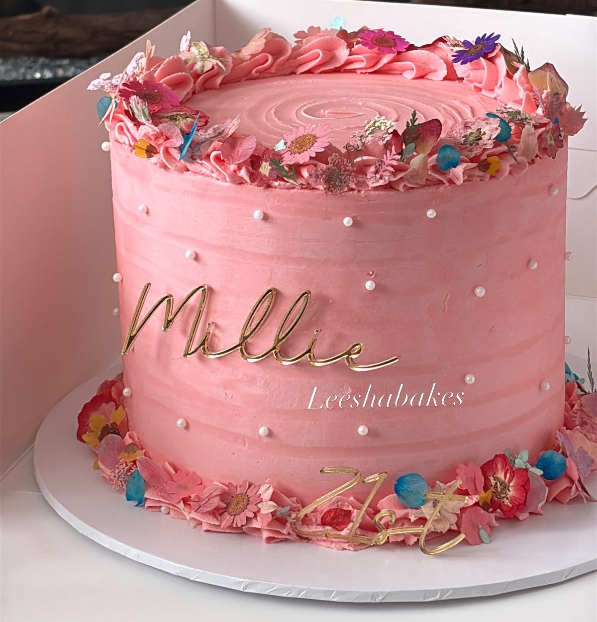 Pink cake with edible flowers