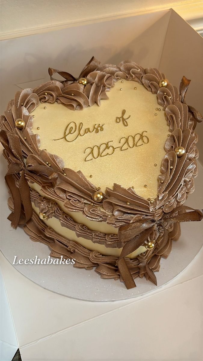 Chocolate heart cake with gold beads, brown bows and 'Class of 2025-2026' message